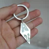 pendentif chaîne dragon continent brillant, bijoux fantaisie, brille dans le noir, porte clés de voiture, pendentif de sac