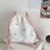 pochette à couches en toile, pochette portable avec nœud imprimé, sac de rangement à cordon de serrage, sac suspendu à cordon de serrage moyen et grand, shopping