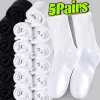 Chaussettes de sport en coton unisexe, douces, confortables, respirantes, décontractées, noir et blanc, Tube moyen, couleur unie, pour hommes et femmes, chaussettes classiques