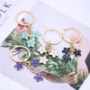 Tendance mignon émail porte-clés coloré Sakura fleur porte-clés doux porte-clés pour femmes filles sac à main accessoires bijoux à bricoler soi-même Tendance mignon émail porte-clés coloré Sakura fleur porte-clés doux porte-clés pour femmes filles sac à main accessoires bijoux à bricoler soi-même