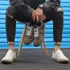 baskets pour hommes 2025 mode en cuir véritable doux chaussures d'entraînement moral décontracté printemps chaussures plates hommes offre spéciale