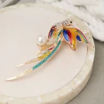 Nouvelle broche phénix en strass à la mode avec longue queue, accessoire exquis pour vêtements et sacs, pièce de tempérament polyvalente Nouvelle broche phénix en strass à la mode avec longue queue, accessoire exquis pour vêtements et sacs, pièce de tempérament polyvalente