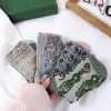 chaussettes lolita rétro à fleurs chaudes, en coton imprimé pour filles, chaussettes jacquard, bonneterie de style collégial, chaussettes de style coréen, bonneterie à tube central