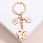 Porte-clés plante mignon Sakura fleur, en émail, pour femmes et filles, accessoire de sac à main, clés de voiture, bricolage, bijoux doux, cadeaux Porte-clés plante mignon Sakura fleur, en émail, pour femmes et filles, accessoire de sac à main, clés de voiture, bricolage, bijoux doux, cadeaux