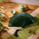 Éventail pliable portable de 21cm, style chinois rétro série verte dégradé de fleurs de cerisier pour danse quotidienne cheongsam Éventail pliable portable de 21cm, style chinois rétro série verte dégradé de fleurs de cerisier pour danse quotidienne cheongsam