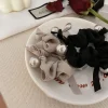 style coréen élégant haut de gamme papillon noeud perle attaches de cheveux femmes bandes de cheveux populaire coréen nouveau modèle accessoires de cheveux