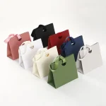 Sacs cadeaux avec poignées en papier, sac à main avec ruban à nœud, emballage de bijoux, anniversaire, mariage, remise de diplôme, célébration, emballage cadeau Sacs cadeaux avec poignées en papier, sac à main avec ruban à nœud, emballage de bijoux, anniversaire, mariage, remise de diplôme, célébration, emballage cadeau