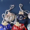 Étui à colliers brodé en tissu à motif de fleurs avec cordon de serrage, sachet vide, pochette à bijoux pour femmes, sac de rangement de style chinois
