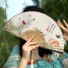Éventail pliant de style chinois, squelette en bambou, artisanat traditionnel, style ancien, élégant avec pompon, éventail de danse hanfu