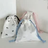 pochette à couches en toile, pochette portable avec nœud imprimé, sac de rangement à cordon de serrage, sac suspendu à cordon de serrage moyen et grand, shopping