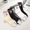 chaussettes de créateurs style coréen dessin animé mignon expression ludique chaussettes femmes à la mode japonais pur coton amusant original mi mollet chaussettes