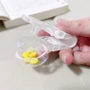 distributeur de médicaments de style japonais, un merde anti contamination de médicaments ménagers, distributeur de comprimés anti contact portable pour th
