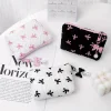 Trousse de maquillage à nœud brodé, niveau d’apparence élevé, sac de rangement pour porte-monnaie, mignon, grande capacité, trousse de maquillage haut de gamme Trousse de maquillage à nœud brodé, niveau d’apparence élevé, sac de rangement pour porte-monnaie, mignon, grande capacité, trousse de maquillage haut de gamme