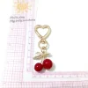 pendentif cerise couleur or k, version coréenne, accessoires en alliage, couvre chef fait à la main, porte clés en forme d'amour