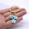 tendance mignon émail porte clés coloré sakura fleur porte clés doux porte clés pour femmes filles sac à main accessoires bijoux à bricoler soi même