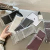 chaussettes unisexes pour hommes et femmes, tube haut en coton, chaussettes de sport de haute qualité, solides, noires et blanches