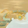 bijoux fins style anniversaire cadeau zodiaque dragon décoration hotan jade bracelet lumière luxe sens avancé pour les femmes