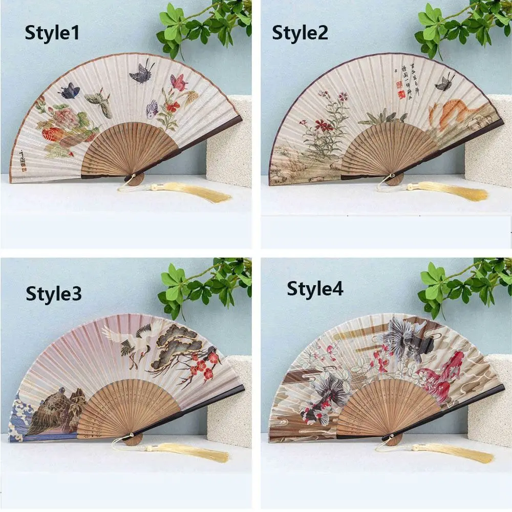 Éventail pliant de style chinois, squelette en bambou, artisanat traditionnel, style ancien, élégant avec pompon, éventail de danse hanfu Éventail pliant de style chinois, squelette en bambou, artisanat traditionnel, style ancien, élégant avec pompon, éventail de danse hanfu
