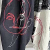 conception originale top yamamoto : pantalon à la cheville à imprimé floral yuka asakura, pantalon à jambes larges
