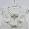 robes féminines élégantes blanc cassé, mini robe sans manches avec nœud, taille haute, coupe cintrée