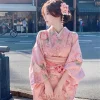 nouvelle mode personnelle rose douce fleur de cerisier fille japonaise voyage photographie améliorée kimono art photo photographie vêtements